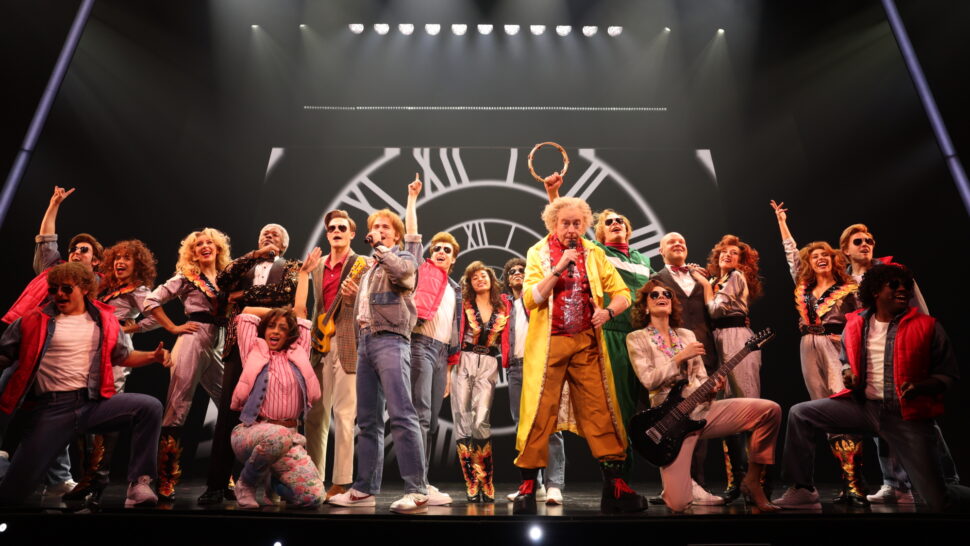 Don Stephenson and the company of Back to the Future: The Musical